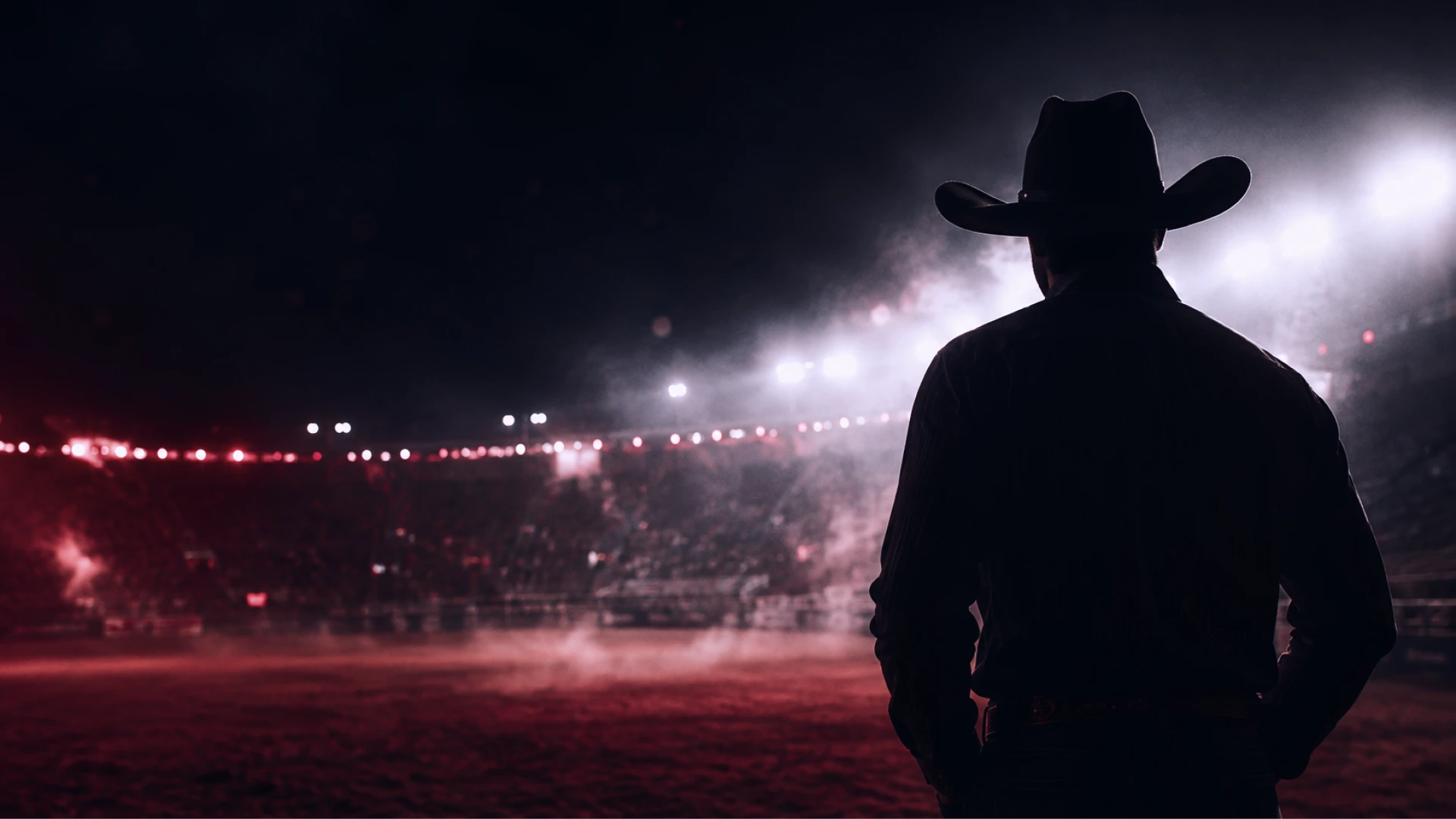Silhueta de cowboy em cenário de rodeio